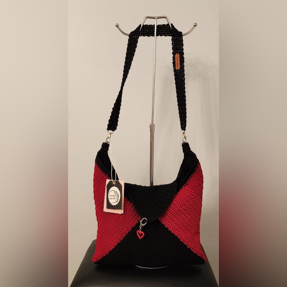 Medium sized red and black handbag with removeable strap and charm!